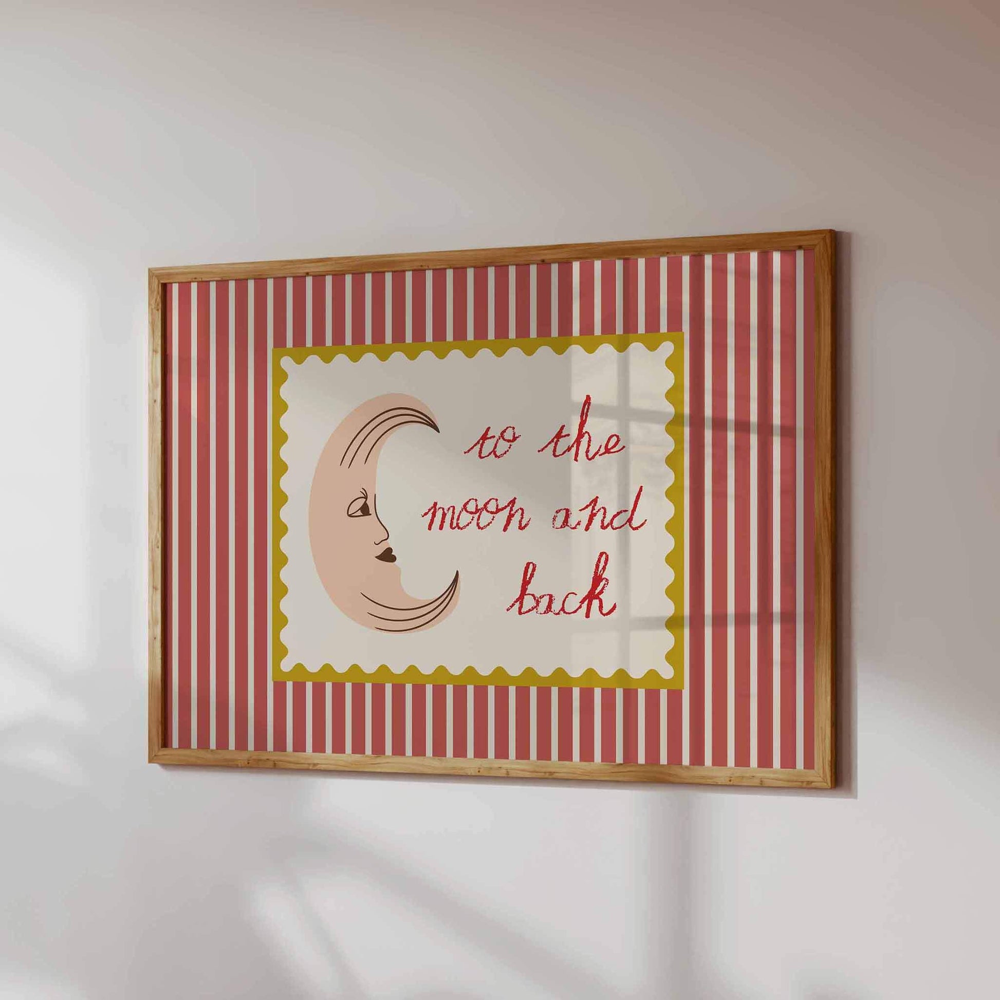 Framed artwork with a red and white striped border and 'to the moon and back' text.