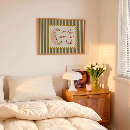 Bedroom with a bed, nightstand, lamp, and framed picture on the wall.