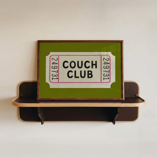 A retro horizontal print with an olive green background and a ticket stub in the centre with the words COUCH CLUB inside.