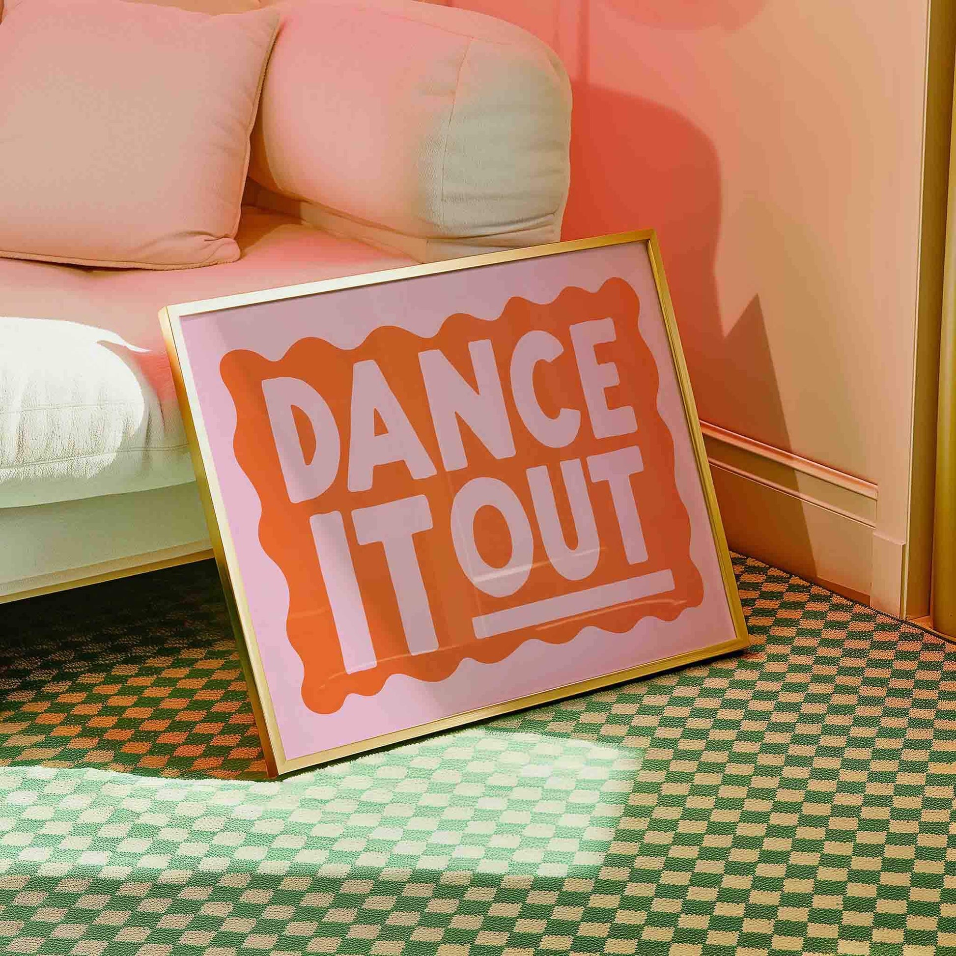 a pink sign with the text "DANCE IT OUT" in a checkered pattern on a green and white checkered floor.
