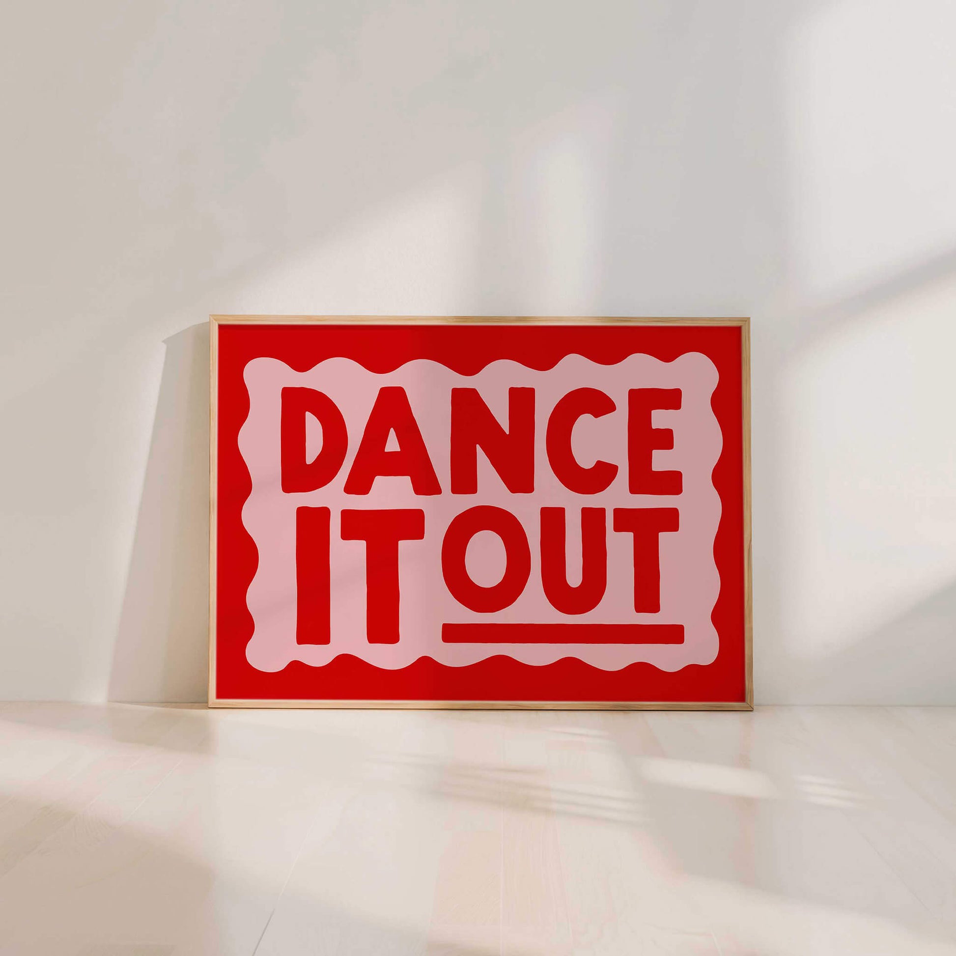 A large red sign with the text "DANCE IT OUT" in bold white letters.