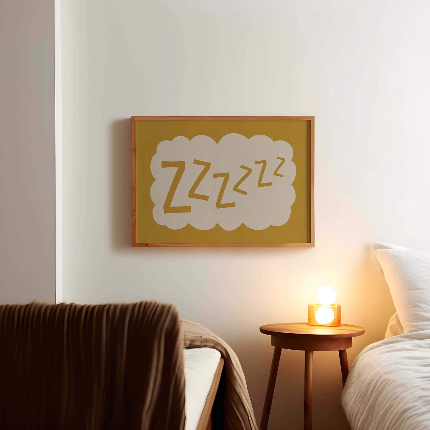 a cozy bedroom scene with a bed, a nightstand, and a framed picture on the wall.